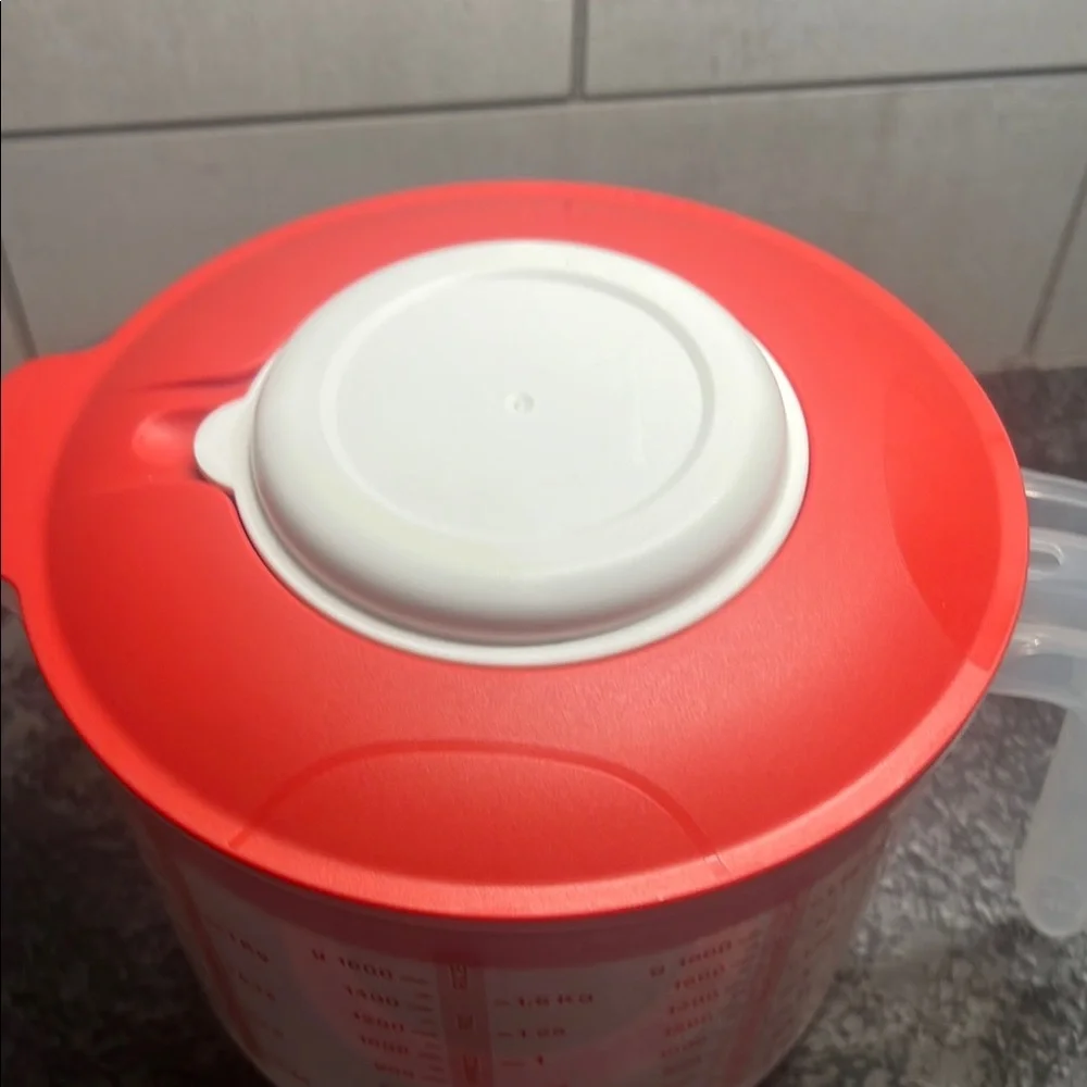 Tupperware Mix n Store Red and White Measuring cup. New without tags